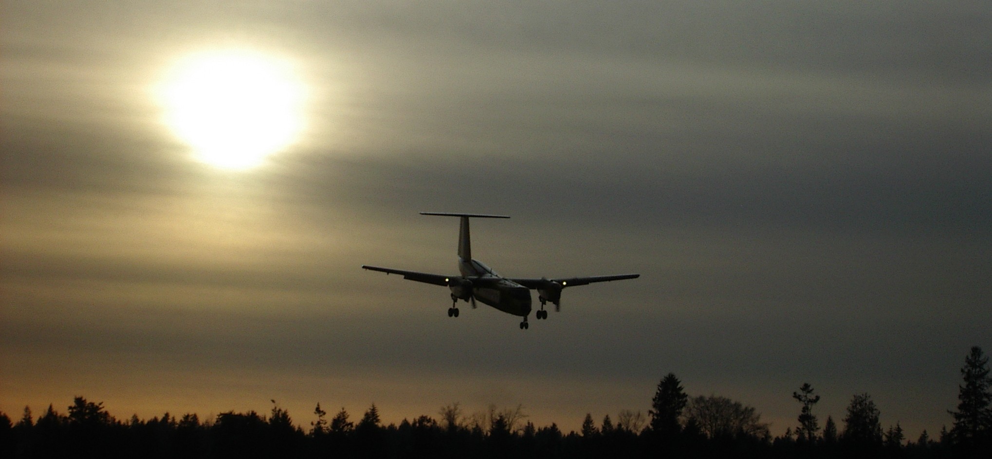 This photograph was taken by Commercial Pilot Graduate George Capone, and captures a Canadian Air Force Buffallo on final approach to Langley Airport's Runway 01 