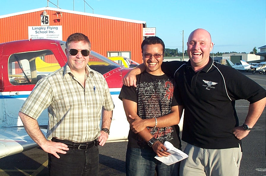 Aaron Pinto with Flight Instructor Rod Giesbrecht and Pilot Examiner Jim Scott after the successful completion of Aaron's Private Pilot Flight Test on July 22, 2008. Langley Flying School.