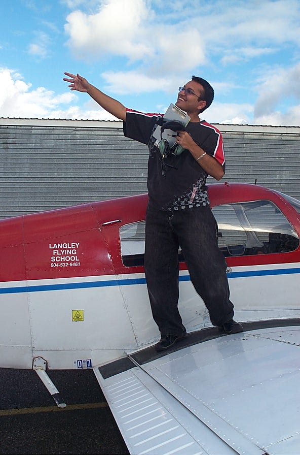 Aaron Pinto on the wing of Cherokee FKKF after completing his First Solo Flight on November 13, 2007. Langley Flying School.