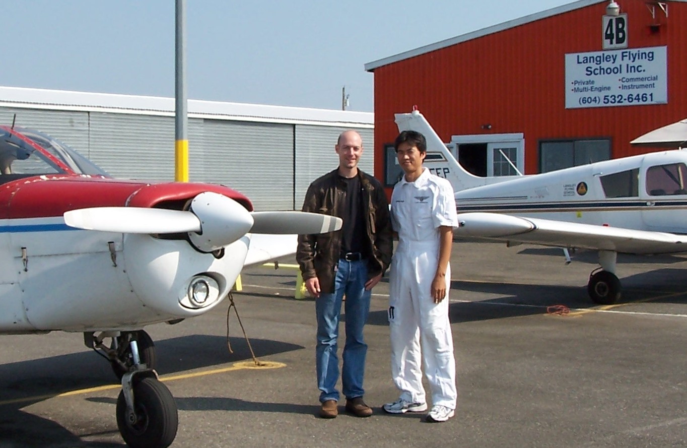 Pilot Adam Helfer with his Flight Instructor, Hoowan Nam, after completing his qualifying flight.  Langley Flying School.