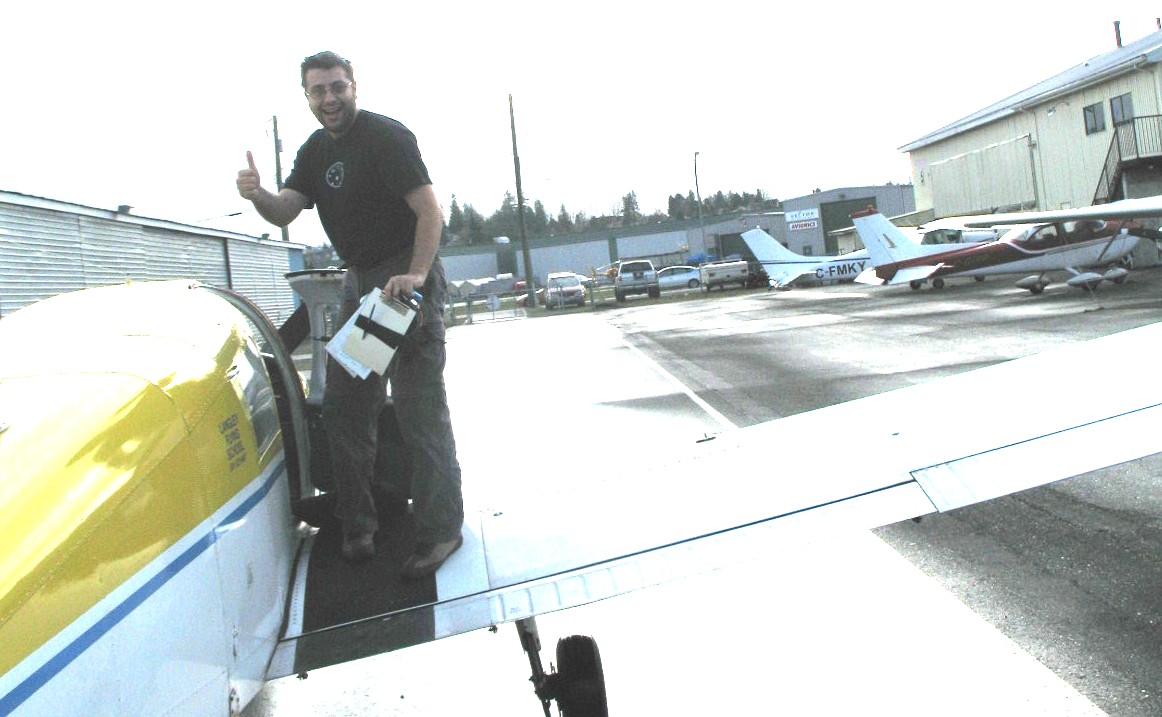 Alex Cadar on the wing of Cherokee GODP after the completion of his First Solo Flight on November 22, 2008.  Langley Flying School.