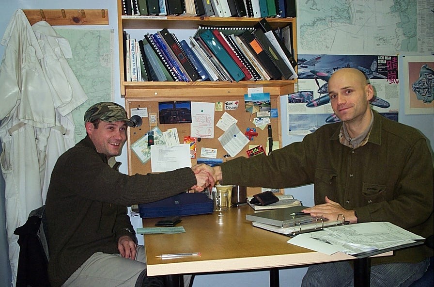 Alex Tremblay with Pilot Examiner Todd Pezer after the successful completion of Alex's Multi-engine Class Rating Flight Test on December 5, 2008. Langley Flying School.