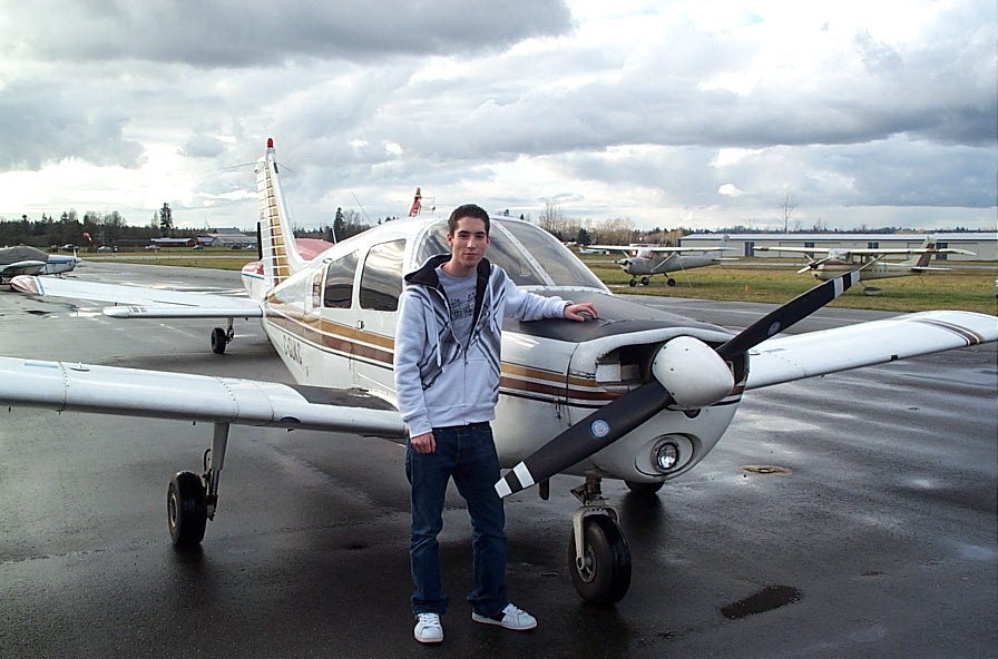 Alex Birch with Cherokee GUKG after completing his First Solo Flight on December 5, 2007. Langley Flying School.