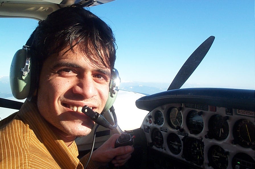 Commercial Pilot Graduate Ali Rumani at the controls of Piper Seneca GURW during the completion of an engine shut-down drill.  Langley Flying School.