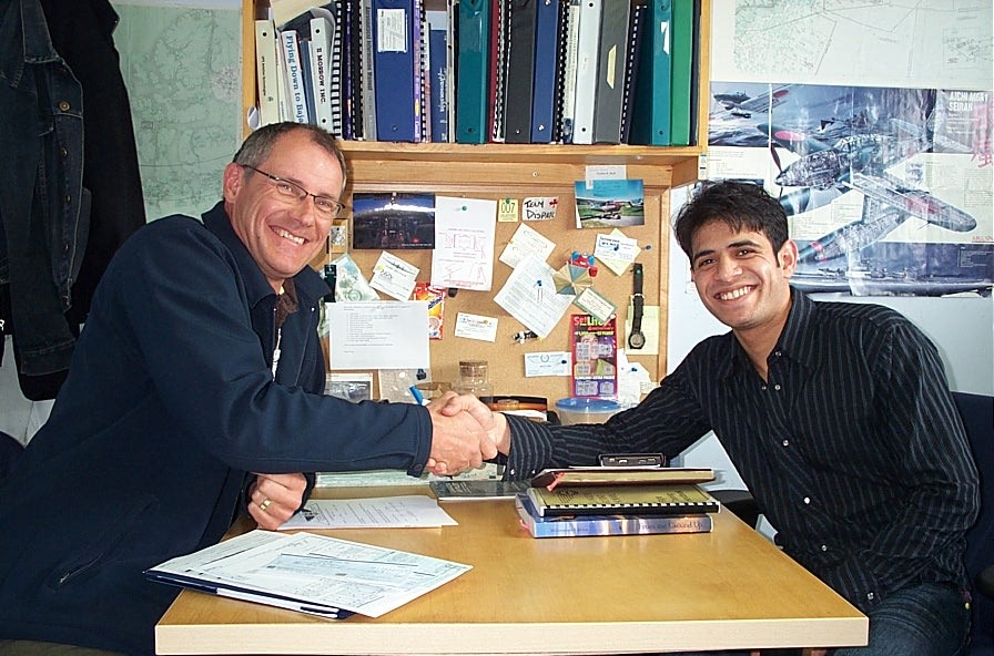 Commercial Pilot Ali Ruman with Pilot Examiner Matt Edwards after the completion of Ali's Group 1 (Multi-engine) Instrument Rating.  May 6, 2009.  Langley Flying School.