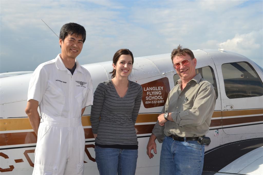 Allison Heathcote with John Laing and her Flight Instructor, Hoowan Nam after the completion of her Private Pilot Flight Test. Langley Flying School.