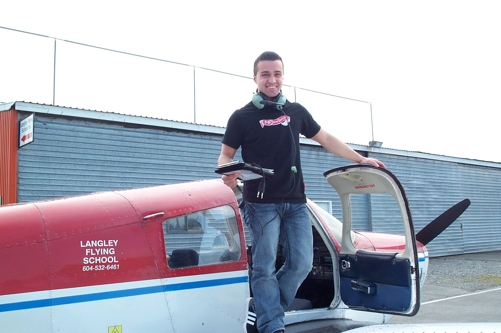Andres Angulo on the wing of Cherokee FKKF after completing his First Solo Flight on April 14, 2010. Langley Flying School.