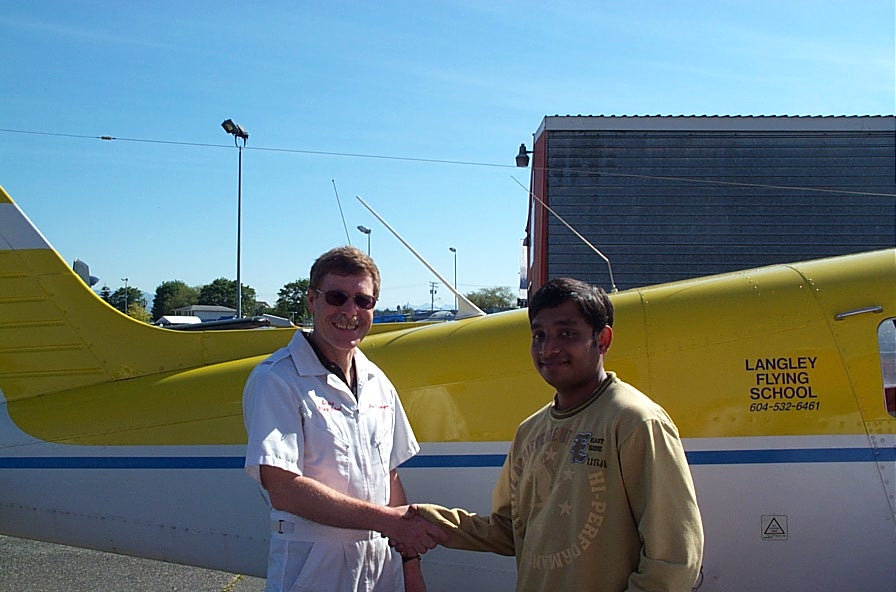 Aniket Chavan with Flight Instructor Peter Waddington after completing his First Solo Flight on May 29, 2007. Langley Flying School