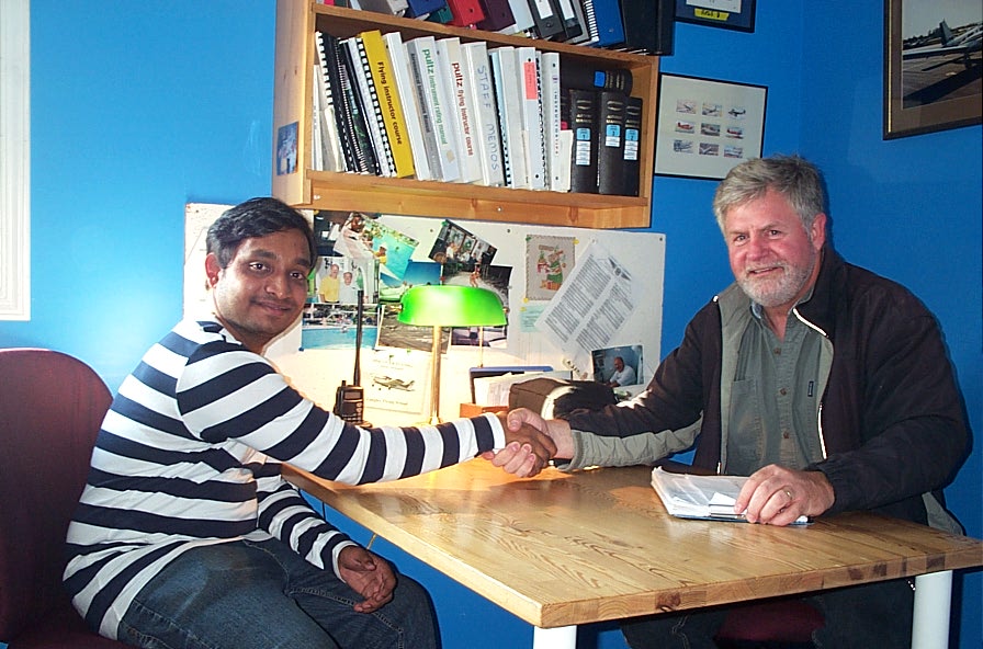 Aniket Chavan receives contratulations from Pilot Examiner Paul Harris after the successful completion of Aniket's Private Pilot Flight Test on August 30, 2008.  Langley Flying School.