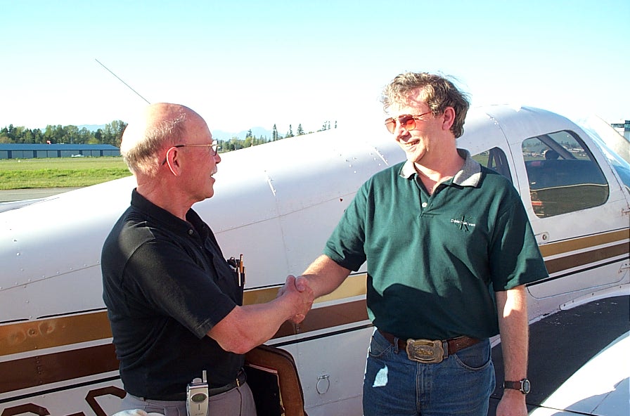 Brian Downing with Pilot Examiner Donn Richardson after the successful completion of Brian's Private Pilot Flight Test.  Langley Flying School.