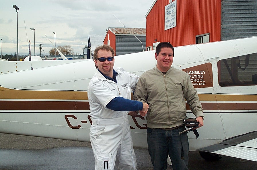 Carlos Calderon Gutierrez with Flight Instructor David Page after Carlos' First Solo Flight on January 15, 2008. Langley Flying School.