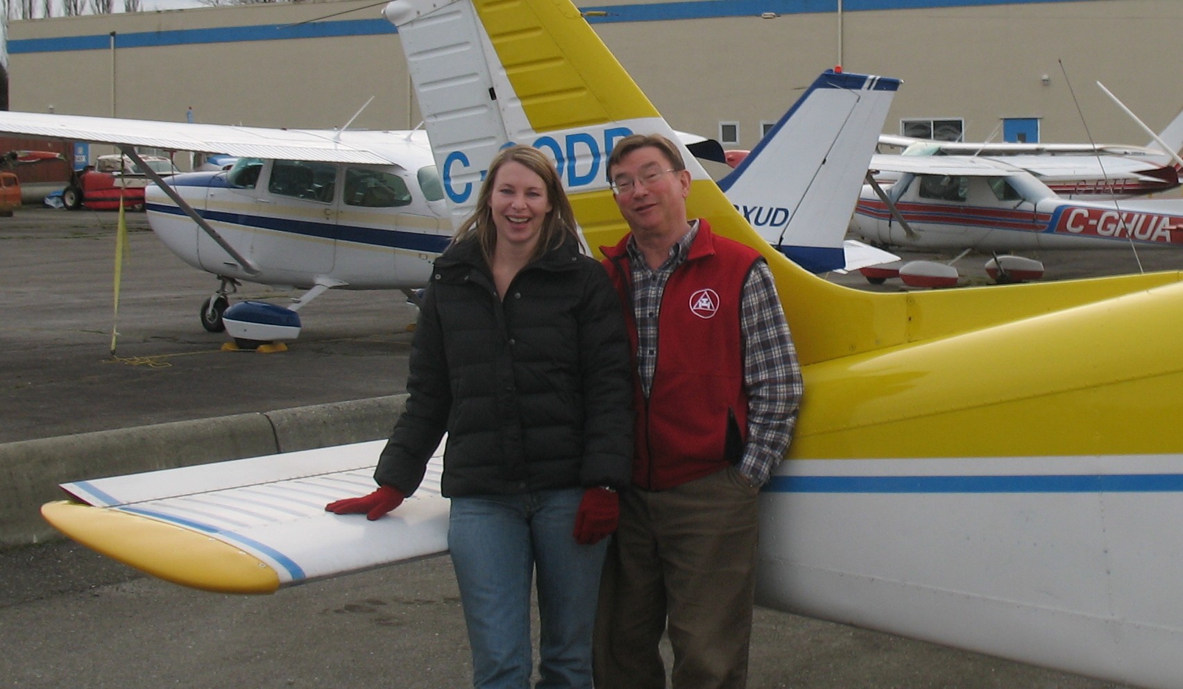 Christine Zboyousky with Pilot Examiner John Laing after the successful completion of Christine's Private Pilot Flight Test on January 7, 2010. Langley Flying School.