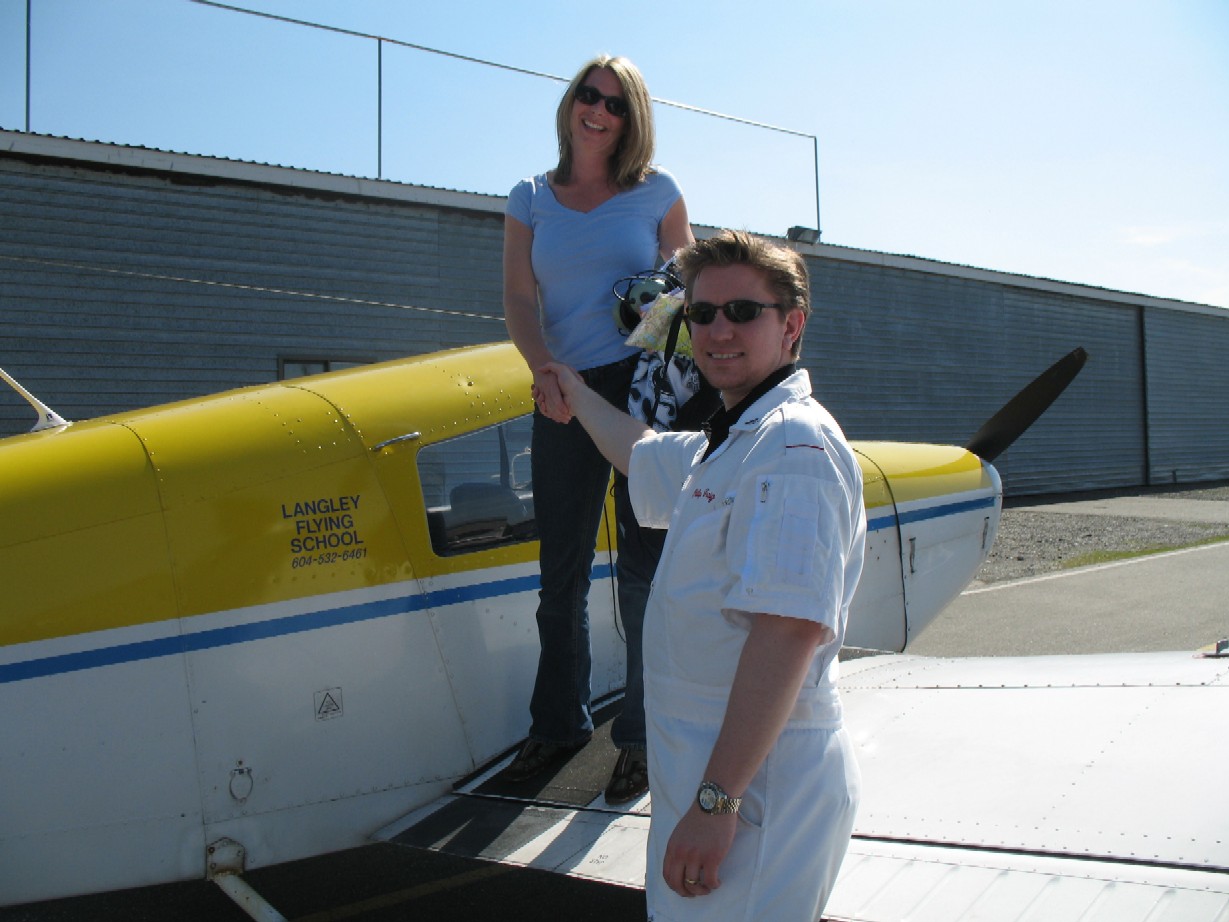 Christine Zbayousky with Flight Instructor Phil Craig after the completion of Christine's First Solo Flight in Cherokee GODP on April 20, 2009.  Langley Flying School.
