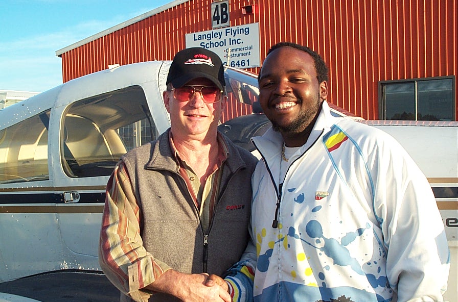 Christopher Russell with John Laing after the successful completion of Chris' Commercial Pilot Flight Test.  Langley Flying School.