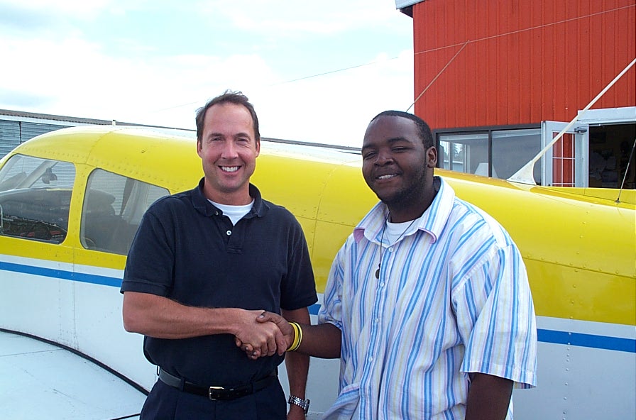 Christopher Russell with Jeff Durand after successful completion of Chris' Private Pilot Flight Test, September 5, 2007, Langley Flying School
