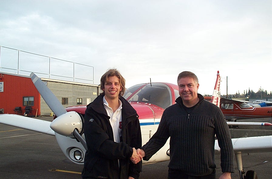 Darren Kroeker with Pilot Examiner Jim Scott after the successful completion of his Private Pilot Flight Test on January 23, 2010. Langley Flying School.