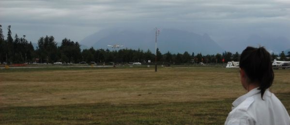 Flight Instructor Naomi Jones looks on as her student, David Whiteley, conduct his first landing as Pilot-in-command on September 6, 2009.  Langley Flying School.