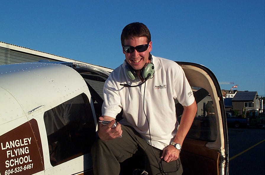 Dean Bicknell on the wing of Cherokee GUKG after completing his First Solo Flight on September 24, 2009. Langley Flying School.
