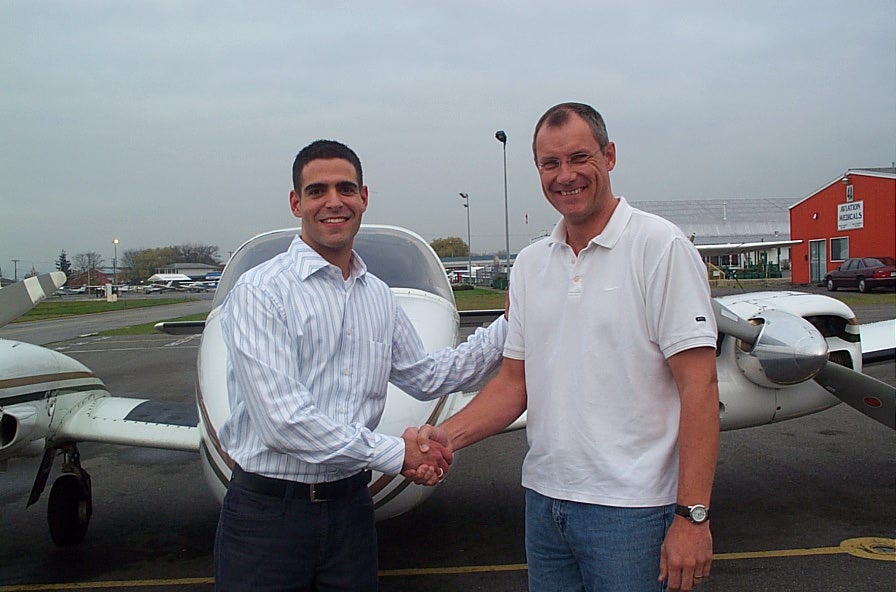 Commercial Pilot Graduate Feras Aboulhosn with Pilot Examiner Matt Edwards after the Feras' Group 1 (Multi-engine) Instrument Rating Flight Test.  Langley Flying School.