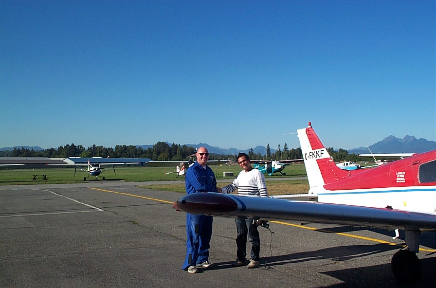 Private Pilot Student Ishan Patel with Flight Instructor Rod Giesbrecht after completing his First Solo Flight on September 22, 2009. Langley Flying School.