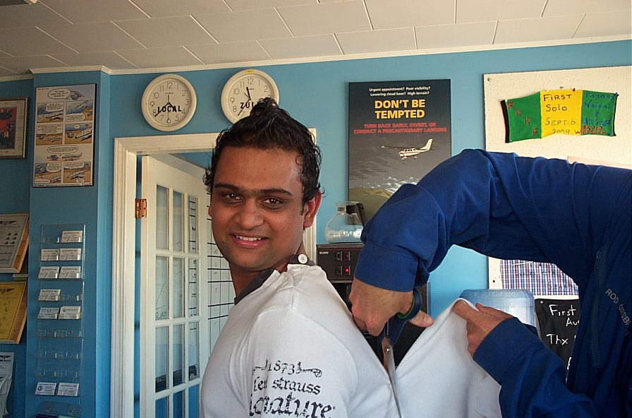 Ishan Patel is tagged (tag removed from his shirt) after completing his First Solo Flight on September 22, 2009. Langley Flying School.