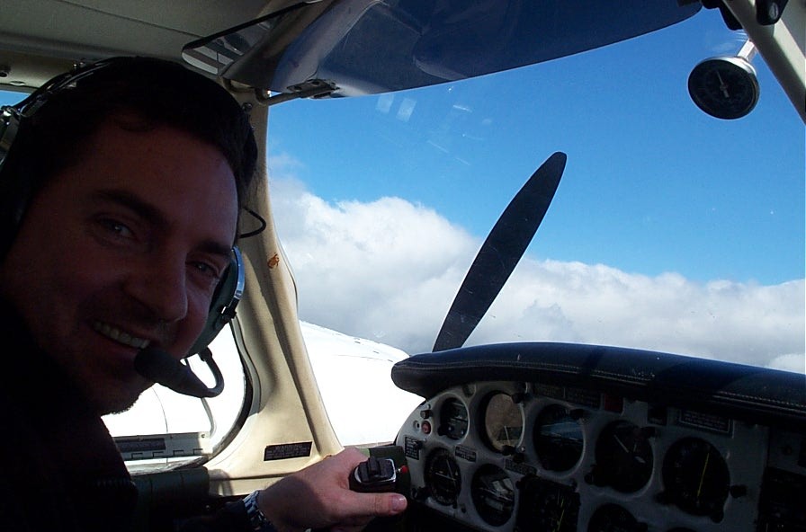 Jim Nichols at the control of the Seneca during an engine shut-down procedure.  Langley Flying School.