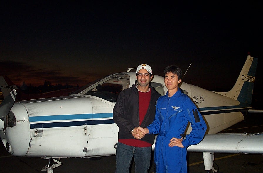 Karn Takkhar with Flight Instructor Hoowan Nam after the completion of Karn's First Solo Flight in Cherokee GNIC on November 4, 2007. Langley Flying School