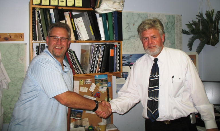 Private Pilot Graduate Kevin Mickelby with Flight Instructor Rod Giesbrecht after the successful completion of his Flight Test.  Langley Flying School.