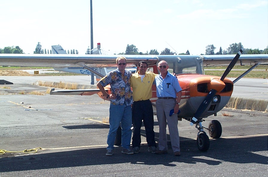 Manish Marwaha (middle) with his Flight Instructor, Dave Woollam and Pilot Examiner Donn Richardson following the successful completion of Manish Commercial Pilot Flight Test in 2004 