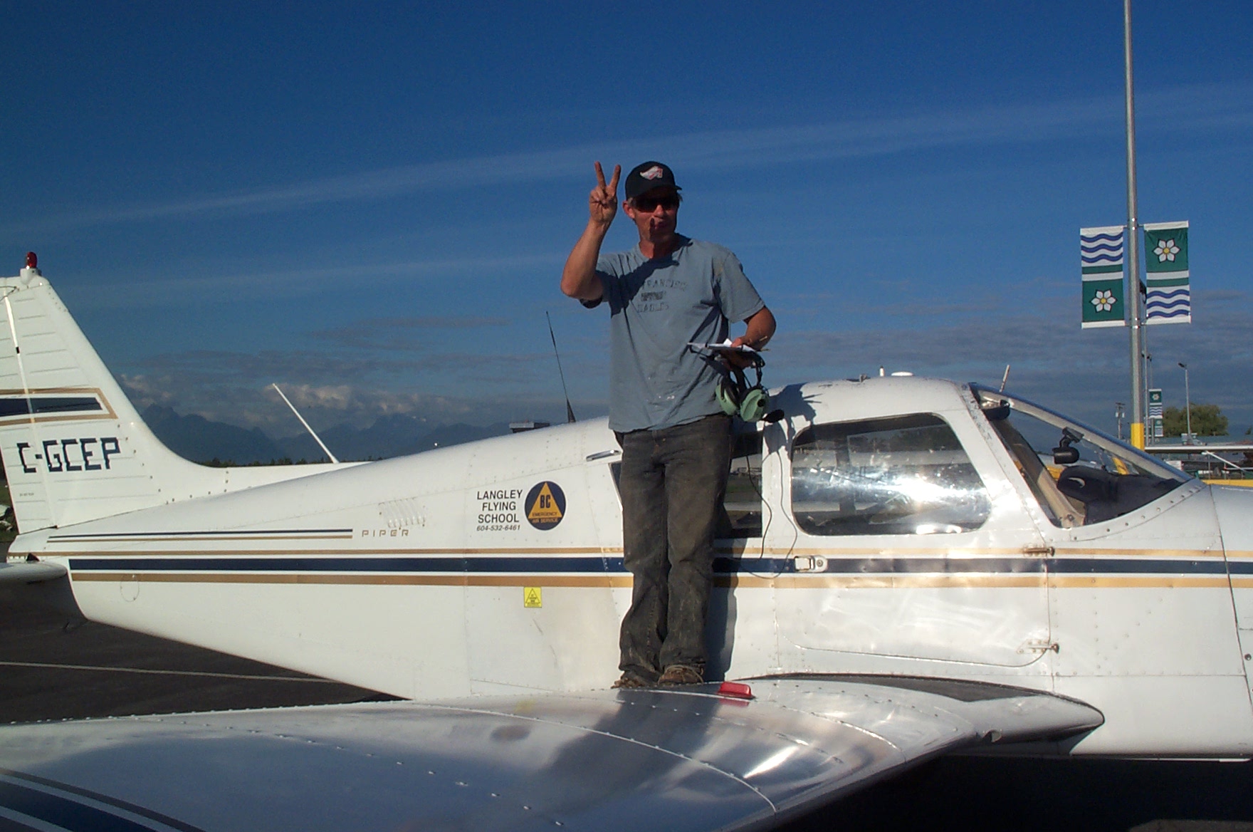 Mark Reid on the wing of Cherokee GCEP after the completion of his First Solo Flight on September 22, 2010.  Langley Flying School.