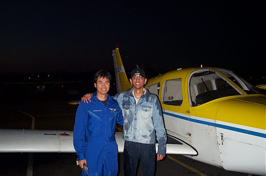 Mayank Mittal (after being soaked by fellow student pilots) with Flight Instructor Hoowan Nam after the completion of Mayank's First Solo Flight on October 26, 2007. Langley Flying School.