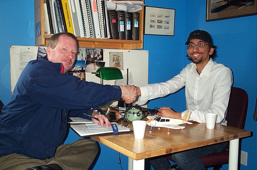 Mayank Mittal receives congratulations from Transport Canada Inspector Peter Cox after the successful completion of Mayank's Flight Instructor Rating on November 4, 2009. Langley Flying School.