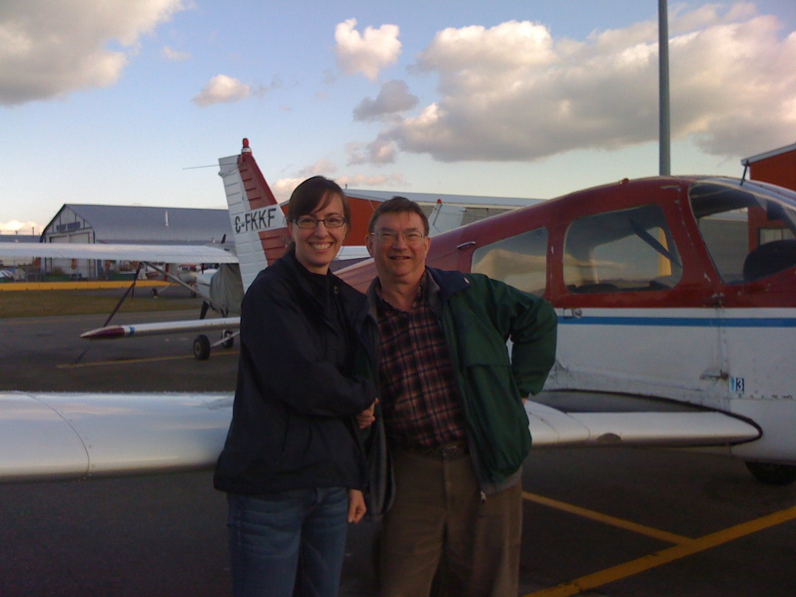 Michelle Thompson with Pilot Examiner John Laing after the completion of Michelle's Private Pilot Flight Test on October , 2009. Langley Flying School.