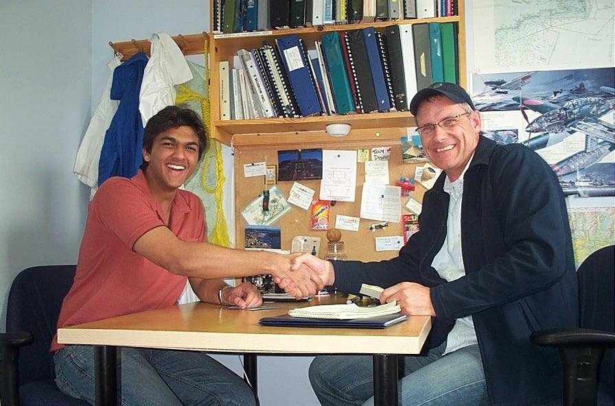 Commerical Pilot Mohit Goyle receives contratulations from Pilot Examiner Matt Edwards after the completion of Mohit's Group 1 (Multi-engine) Instrument Rating Flight Test.  Langley Flying School.