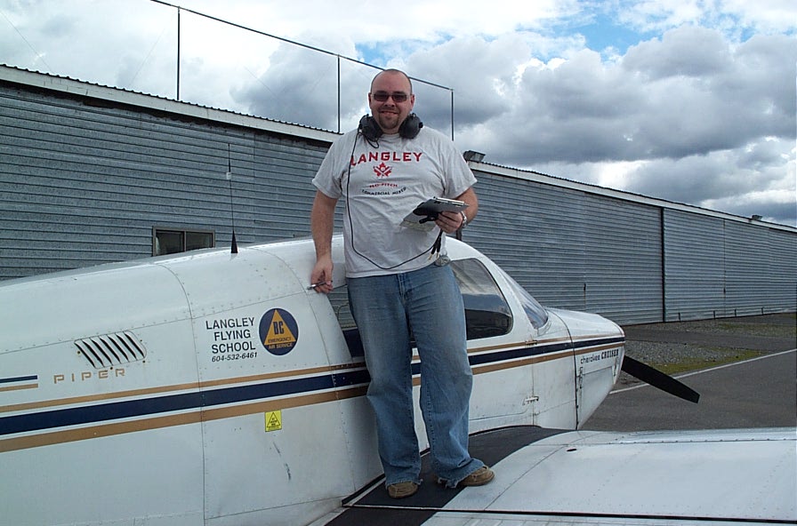 Nathan Twist on the wing of Cherokee GCEP after the completion of his First Solo flight on March 22, 2010. Langley Flying School.