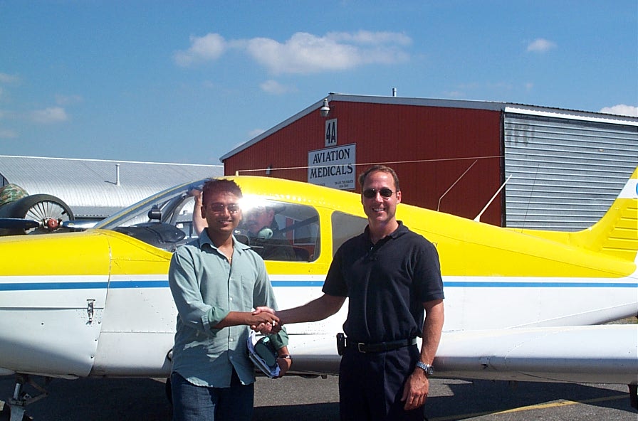 Nikhil Dongare with Jeff Durand after successfully completing his Private Pilot Flight Test on August 23, 2007