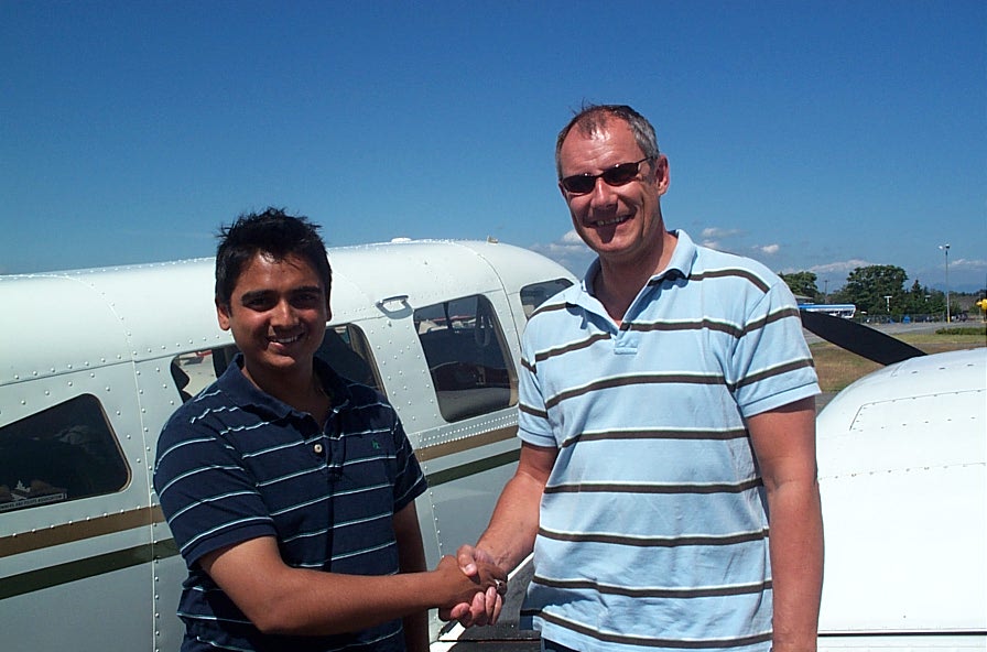 Nikhil Dongare with Pilot Examiner Matt Edwards after the successful completion of Nikhil's Flight Test for his Multi-engine Class Rating on July 9, 2008.  Langley Flying School.