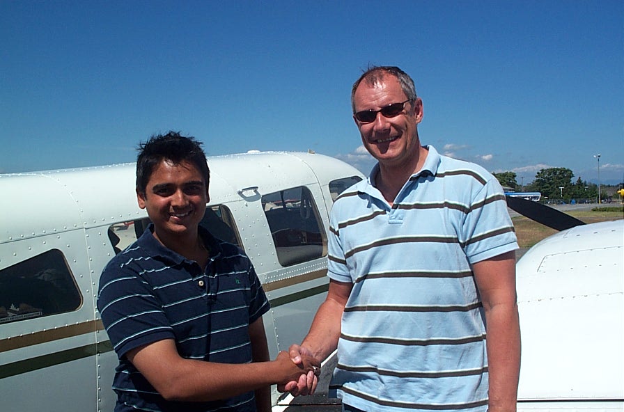 Nikhil Dongare with Pilot Examiner Matt Edwards after the successful completion of Nikhil's Flight Test for his Multi-engine Class Rating on July 9, 2008. Langley Flying School.