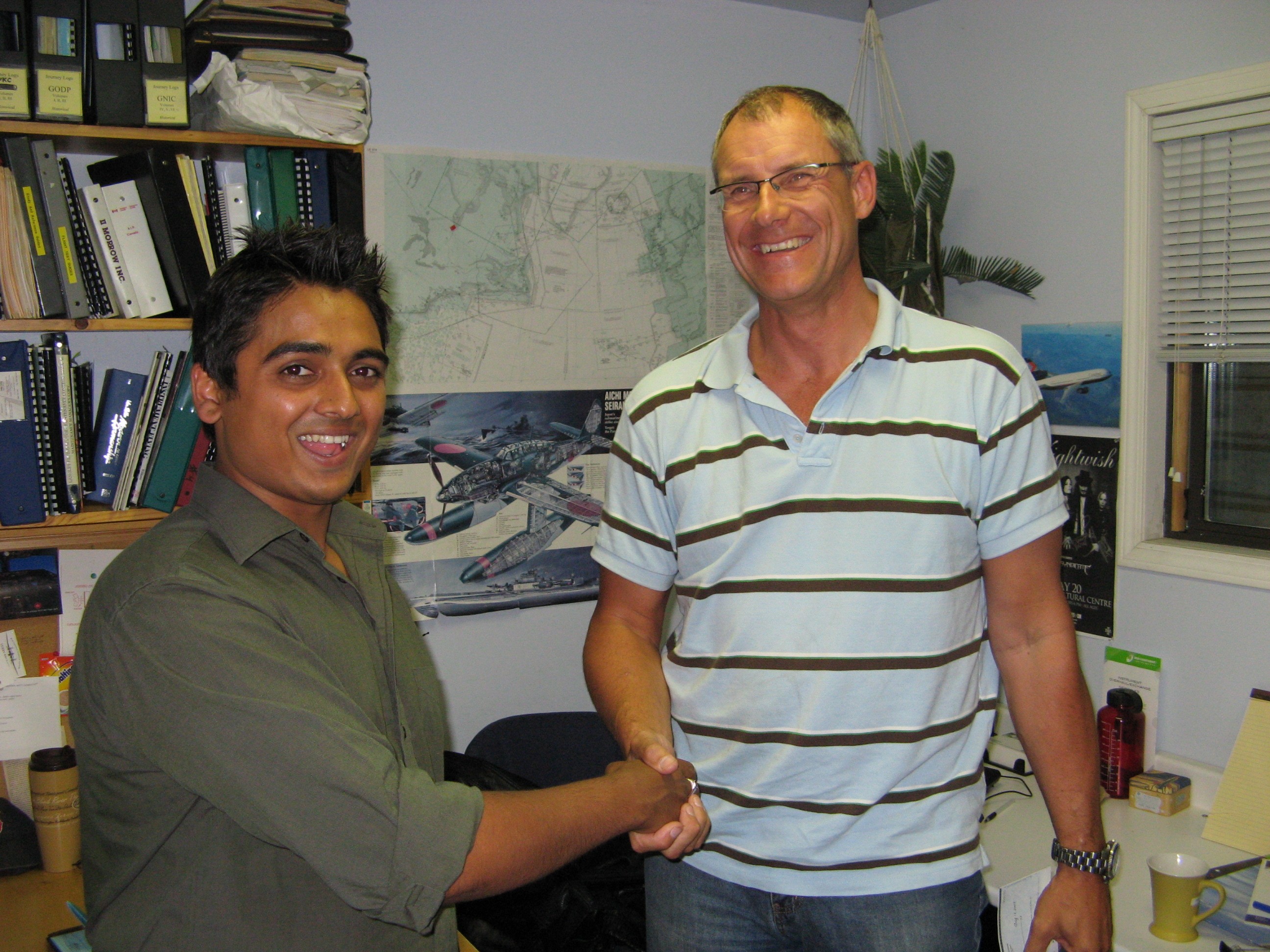 Commercial Pilot Nikhil Dongare with Pilot Examiner Matt Edwards after the successful completion of his Group 1 (Multi-engine) Instrument Rating on August 12, 2008.  Langley Flying School.
