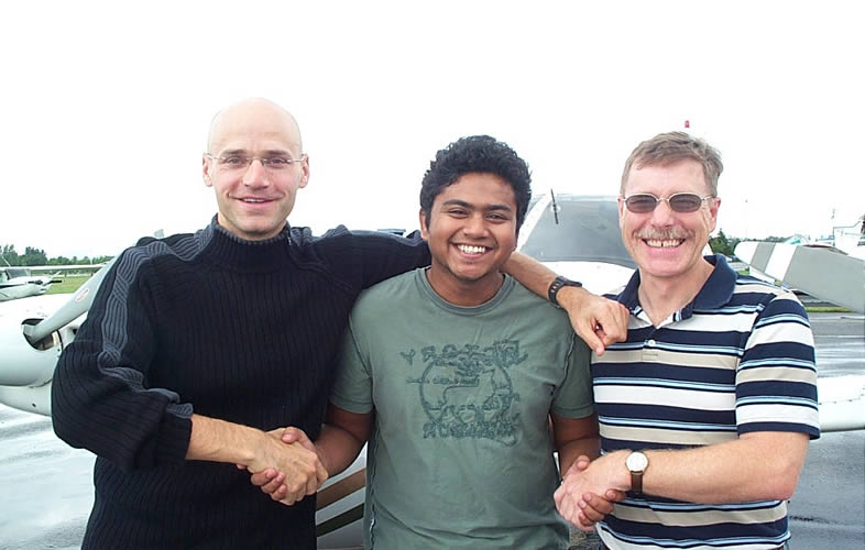 Commercial Pilot Pankaj Salve with Pilot Examiner Todd Pezer and Flight Instructor Peter Waddington after the successful completion of Panks' Flight Test for his Group 1 (Multi-engine) Instrument Rating on August 29, 2008.  Langley Flying School.