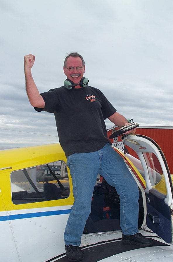 Peter McCreath on the wing of Cherokee GODP after completing his First Solo Flight on October 9, 2007. Langley Flying School.