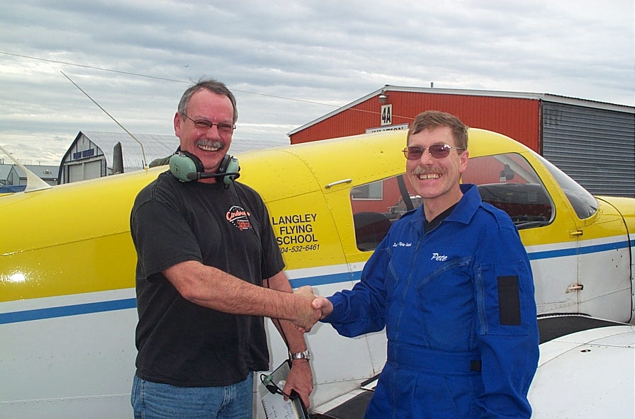 Peter McCreath with Flight Instructor Peter Waddington after the completion of Peter's First Solo Flight on October 9, 2007. Langley Flying School.