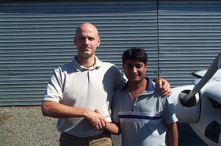 Raman Srivastava receives congratulations from Pilot Examiner Todd Pezer after the successful completion of Raman's Group 1 (Multi-engine) Instrument Rating on September 14, 2008. Langley Flying School.