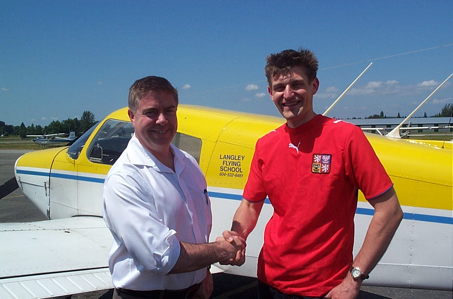 Richard Haisinger with Pilot Examiner Jim Scott after the successful completion of Richard's Private Pilot Flight Test. Langley Flying School.