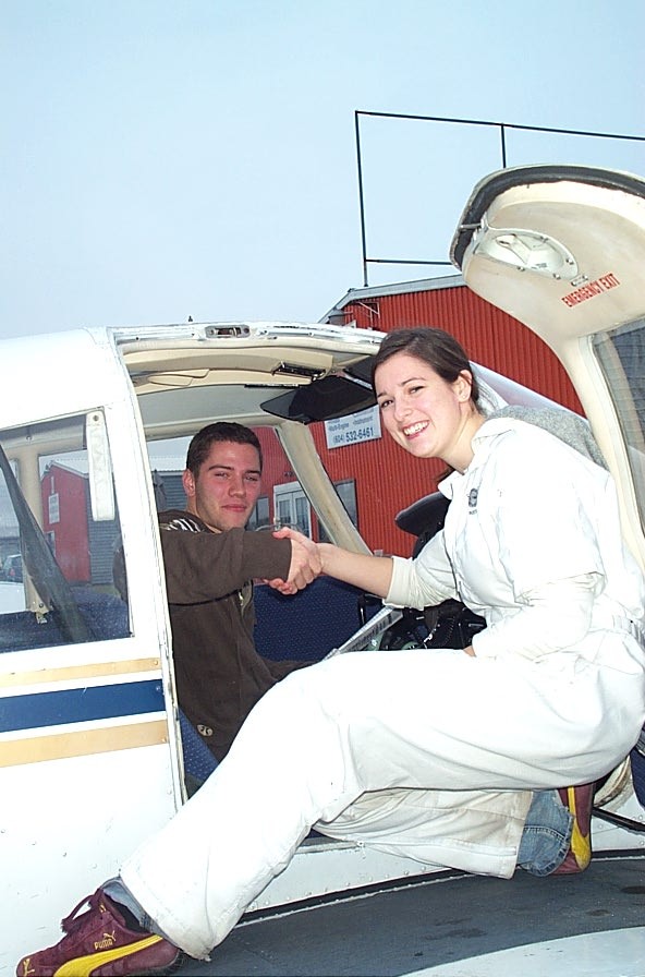 Ryan Ostermeier is congratulated by Flight Instructor Naomi Jones after the completion of his First Solo Flight on November 14, 2008.  Langley Flying School.