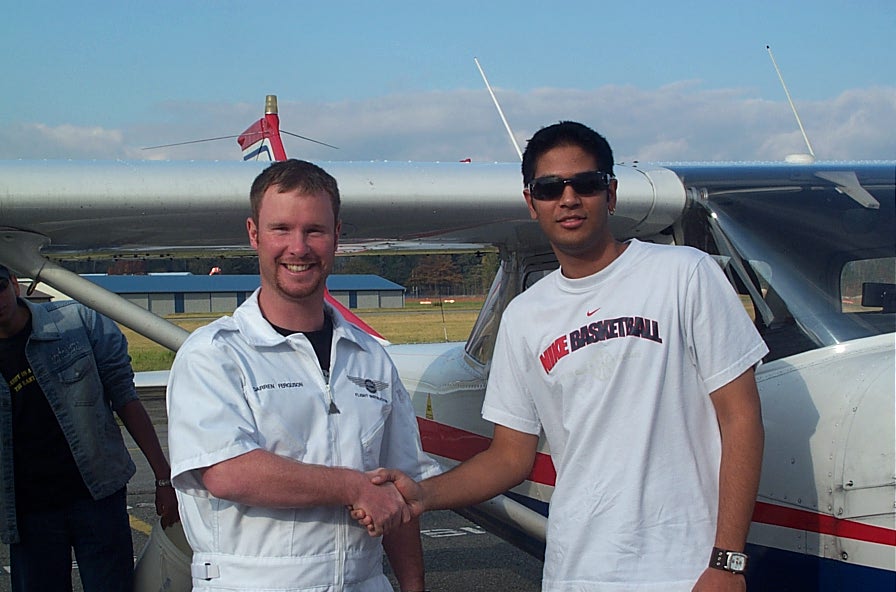 Sagar Canakapalli with Flight Instructor Darren Ferguson after the completion of Sagar's First Solo Flight in Cessna FPRT on November 1, 2007.  Langley Flying School.