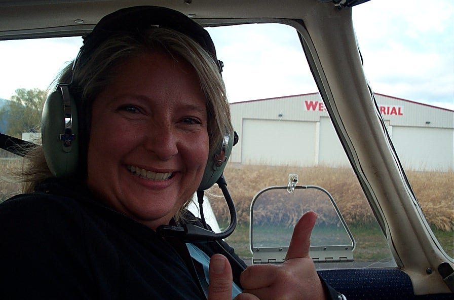 Student Pilot Sandy Wade in the cockpit of Cherokee GCEP after the completion of her First Solo Flight on March 8, 2010. Langley Flying School.