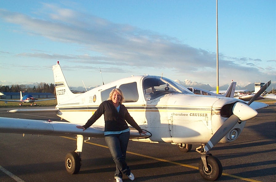 Sandy Wade with Cherokee GCEP after the completion of her First Solo Flight on March 8, 2010. Congratulations also to Sandy's Flight Instructor, Naomi Jones. Langley Flying School.
