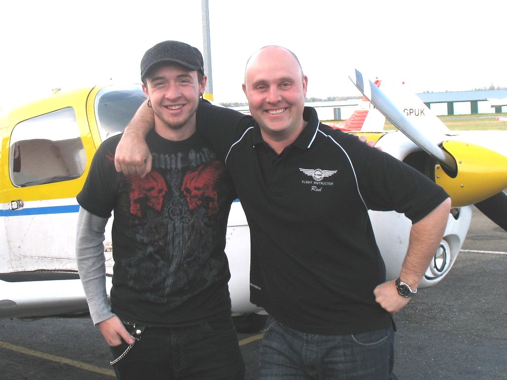 Steve Dirks with Flight Instructor Rod Giesbrecht after the successful completion of Steve's Private Pilot Flight Test on November 23, 2008. Langley Flying School.