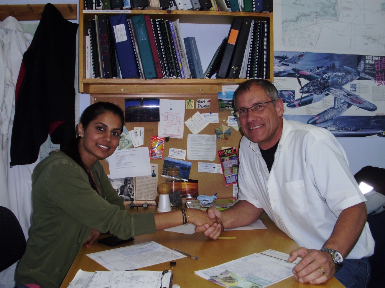 Commercial Pilot Sukhmani Brar with Pilot Examiner Matt Edwards after the successful completion of the Flight Test for Sukhmani's Group 1 (Multi-engine) Rating on May 28, 2009.  Langley Flying School.